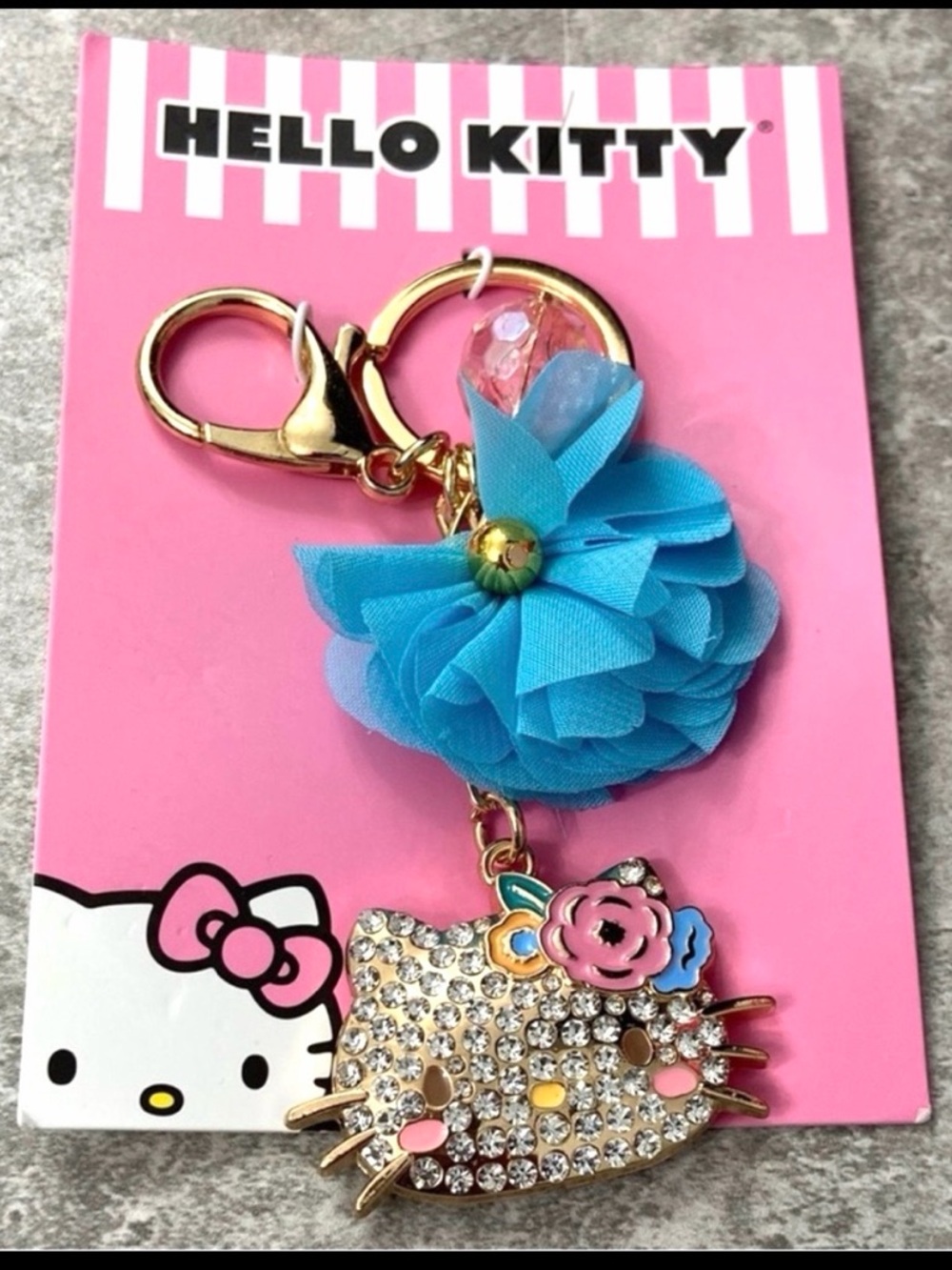 Sanrio Hello Kitty flower rhinestone bag charm keychain with blue chiffon bow